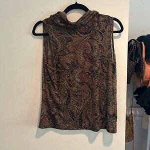 Beaded mock neck sleeveless top.